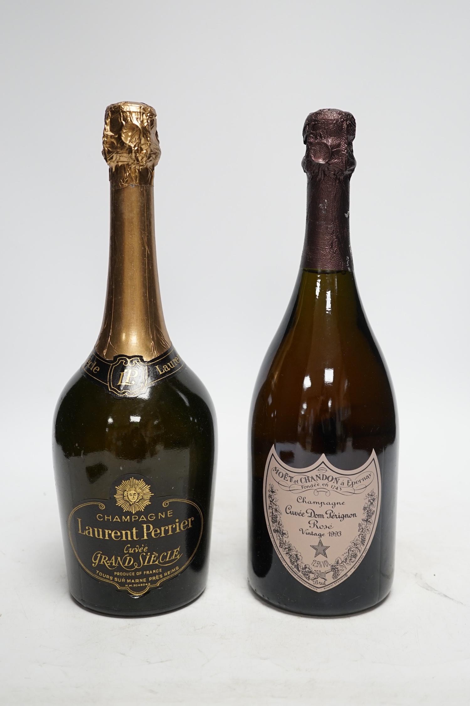 One bottle of Moet et Chandon Dom Perignon vintage champagne 1993 and one bottle of Laurent Perrier, both boxed. Condition - good